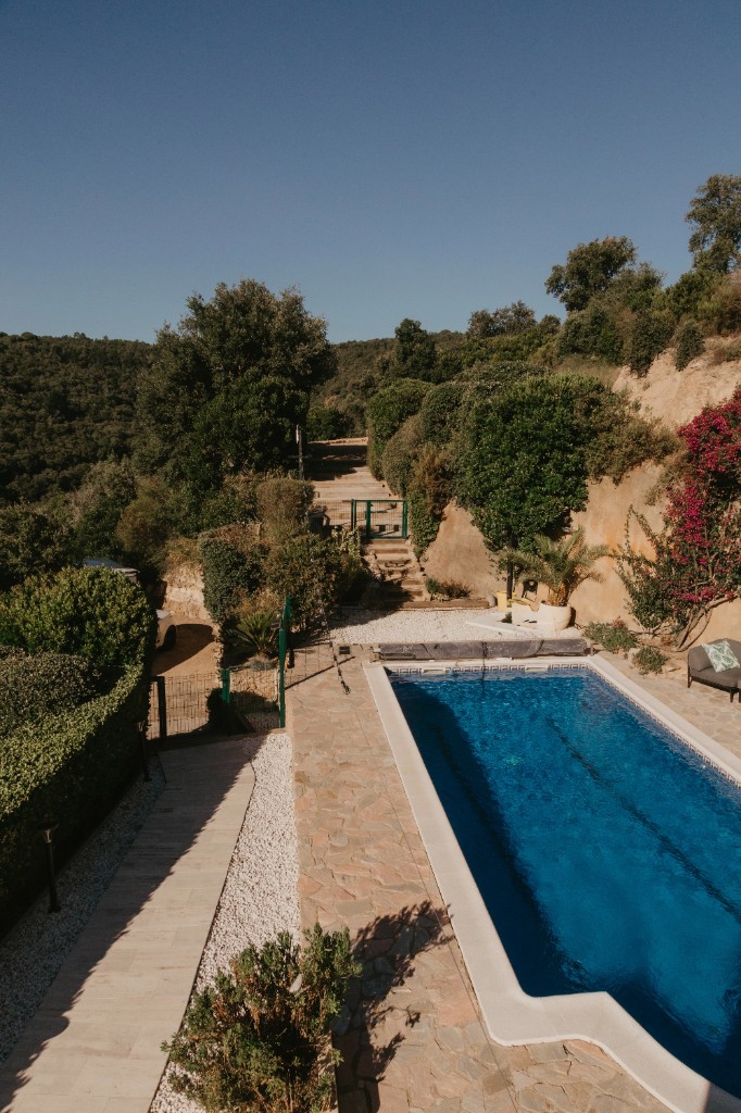 Pool area and hillside setting at the retreat villa